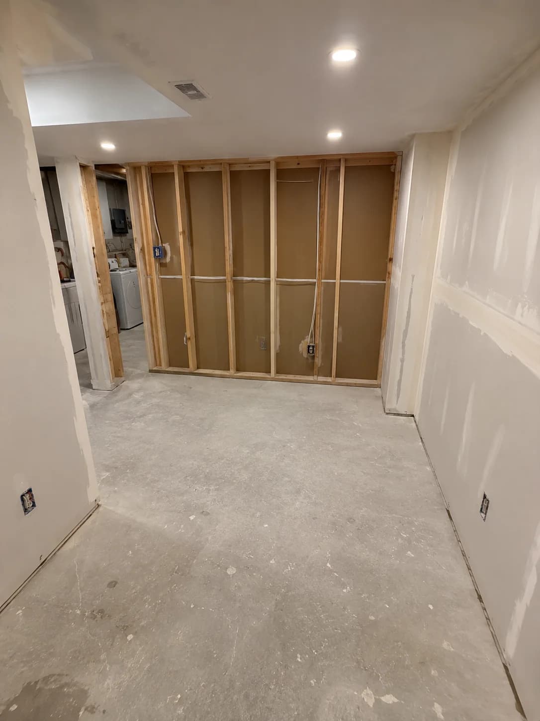 Empty unfinished basement before conversion to apartment